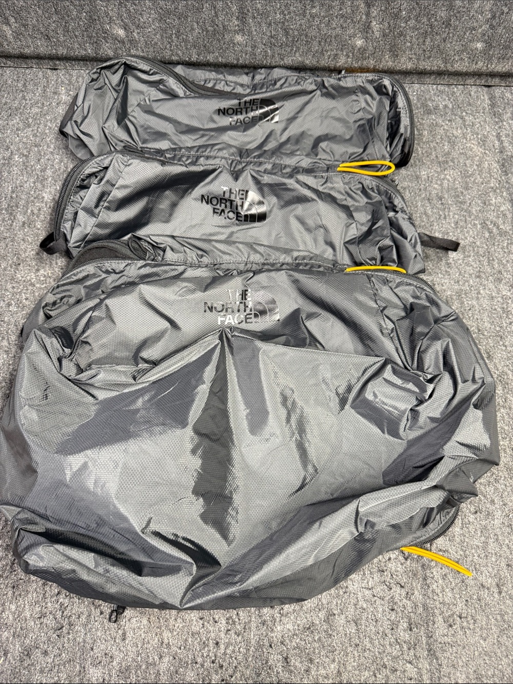 The North Face set of 4 Gray luggage Pack with Yellow Pull Tabs - Picture 5 of 8